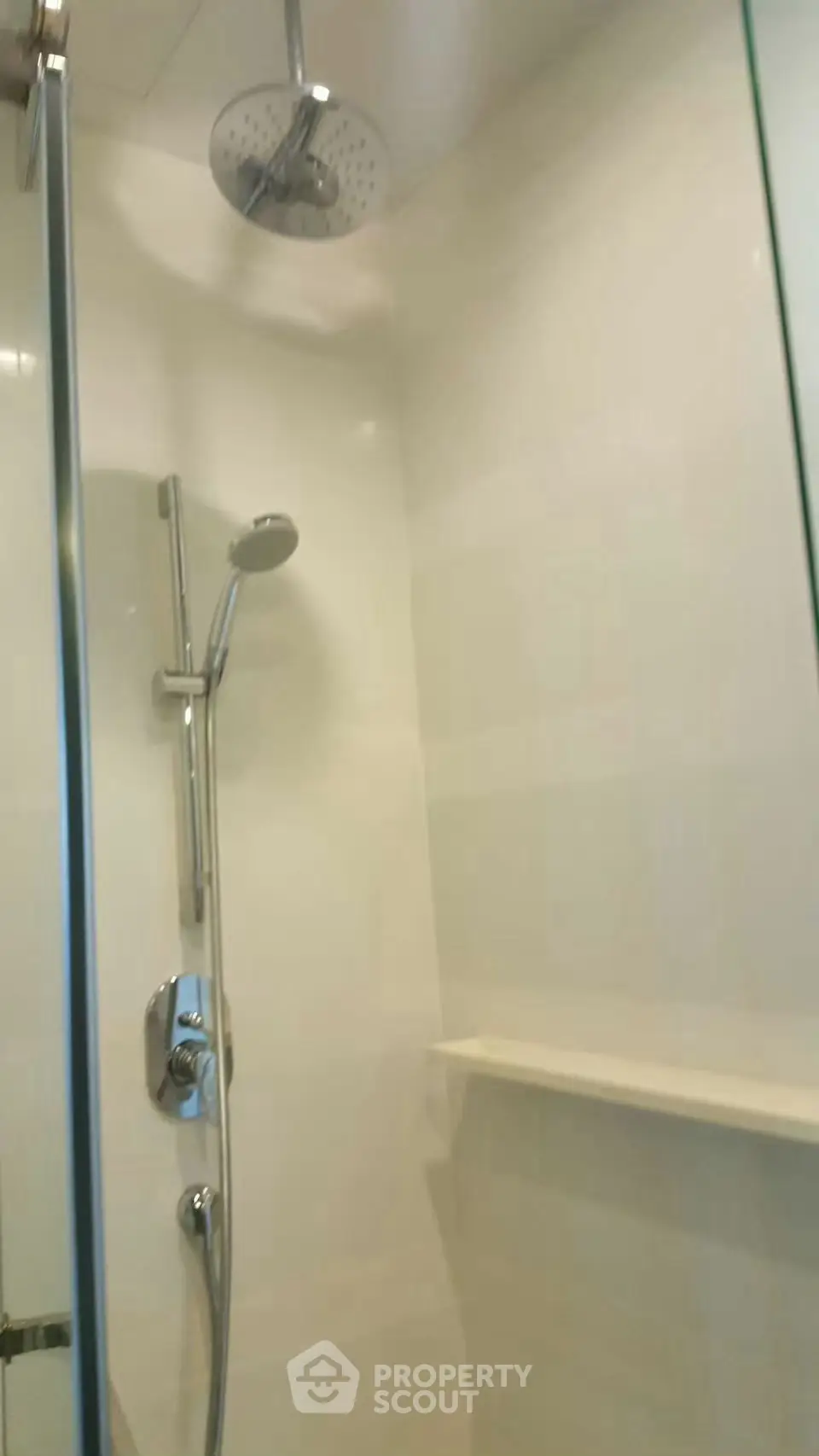 Modern bathroom with sleek shower fixtures and glass enclosure