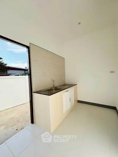 Modern minimalist kitchen with open layout and sleek design