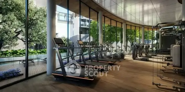 Modern gym with large windows overlooking lush greenery and pool area.