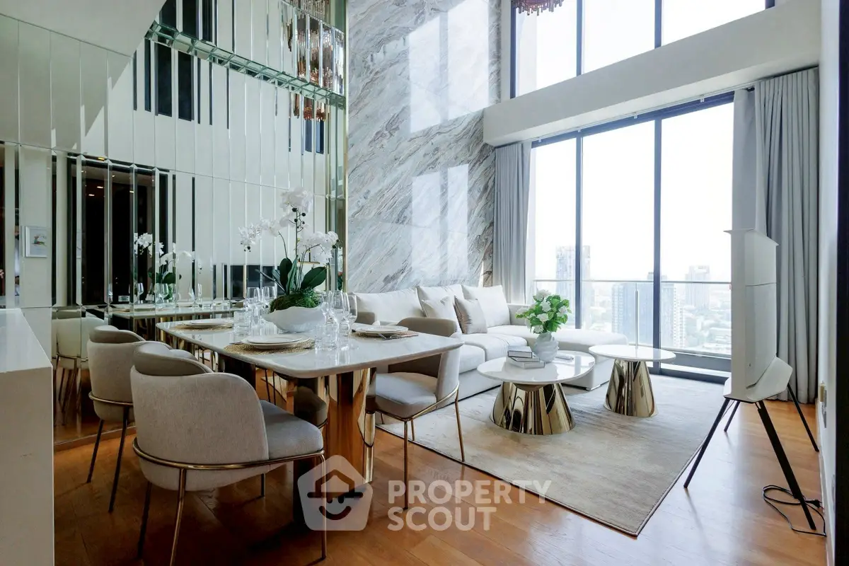 Luxurious modern living room with floor-to-ceiling windows and elegant dining area