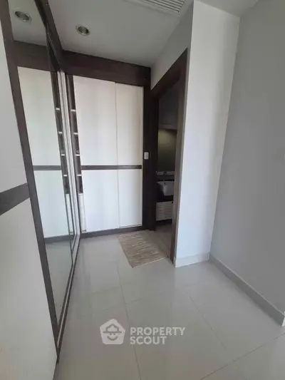 Modern hallway with sleek closet and minimalist design