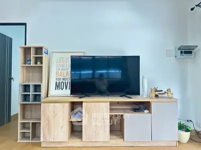 Modern living room with stylish wooden TV stand and decor