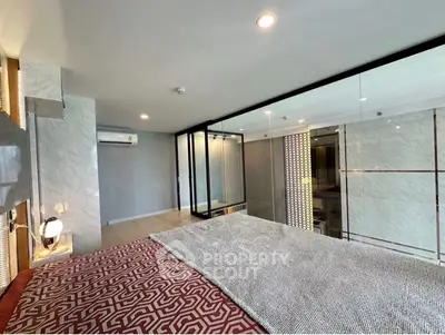 Luxurious modern bedroom with glass wall and stylish decor