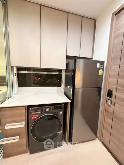 Modern kitchen with sleek appliances and ample storage space