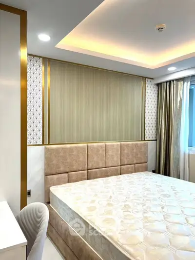 Luxurious bedroom with elegant decor and plush bedding in modern apartment