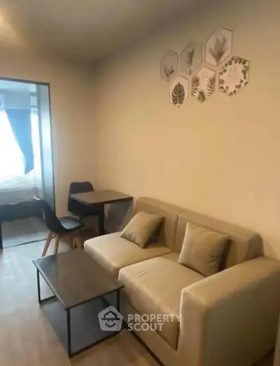 Cozy living room with modern decor and comfortable seating in a stylish apartment.