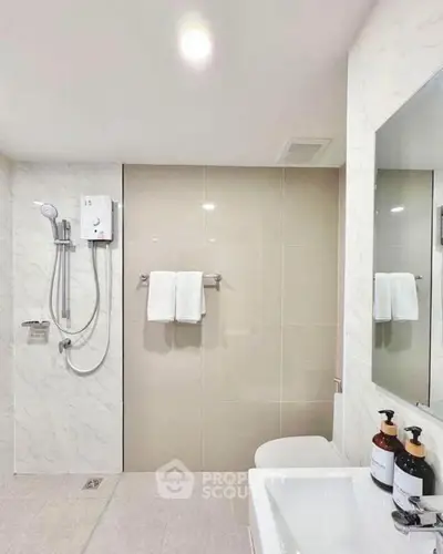 Modern bathroom with sleek shower and elegant fixtures