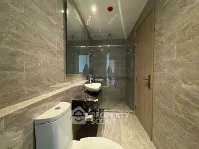 Luxurious modern bathroom with marble tiles and sleek fixtures