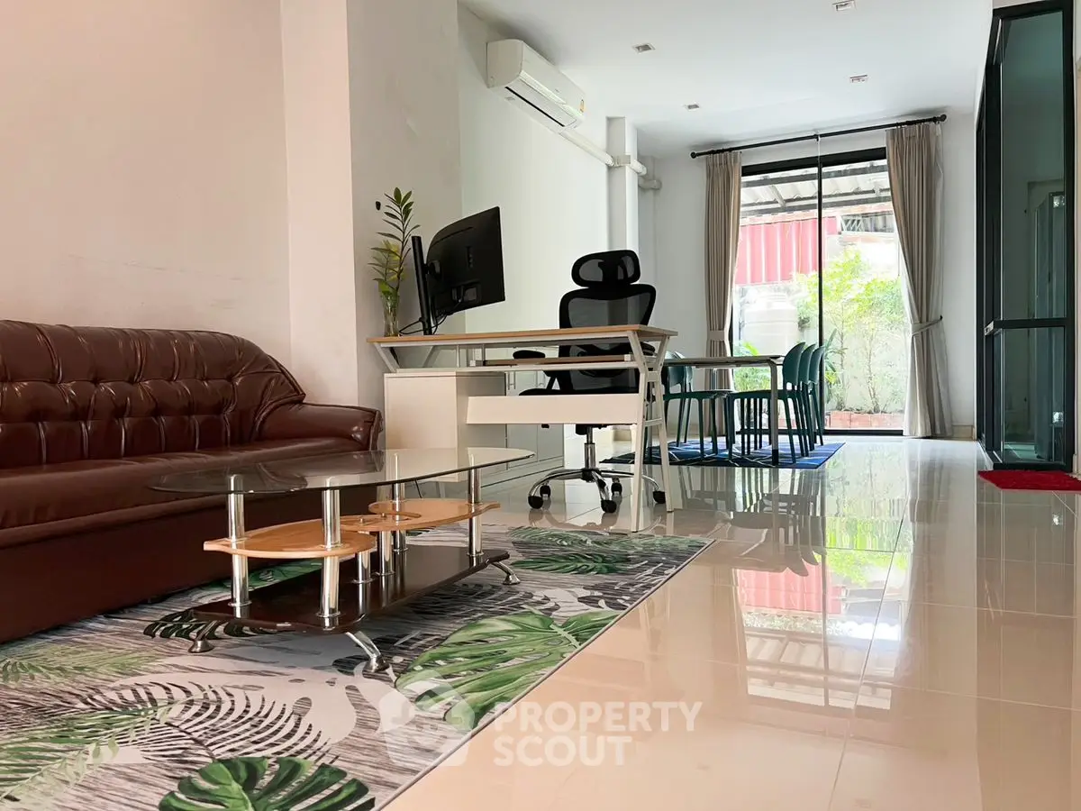 Modern living room with sleek furniture and natural light, perfect for urban living.