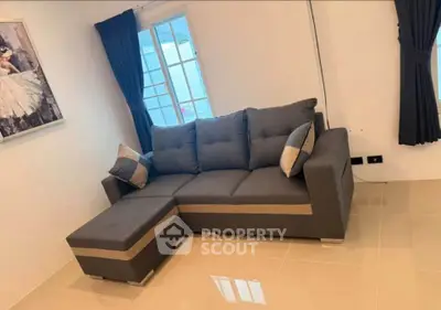Cozy living room with modern gray sofa and stylish decor