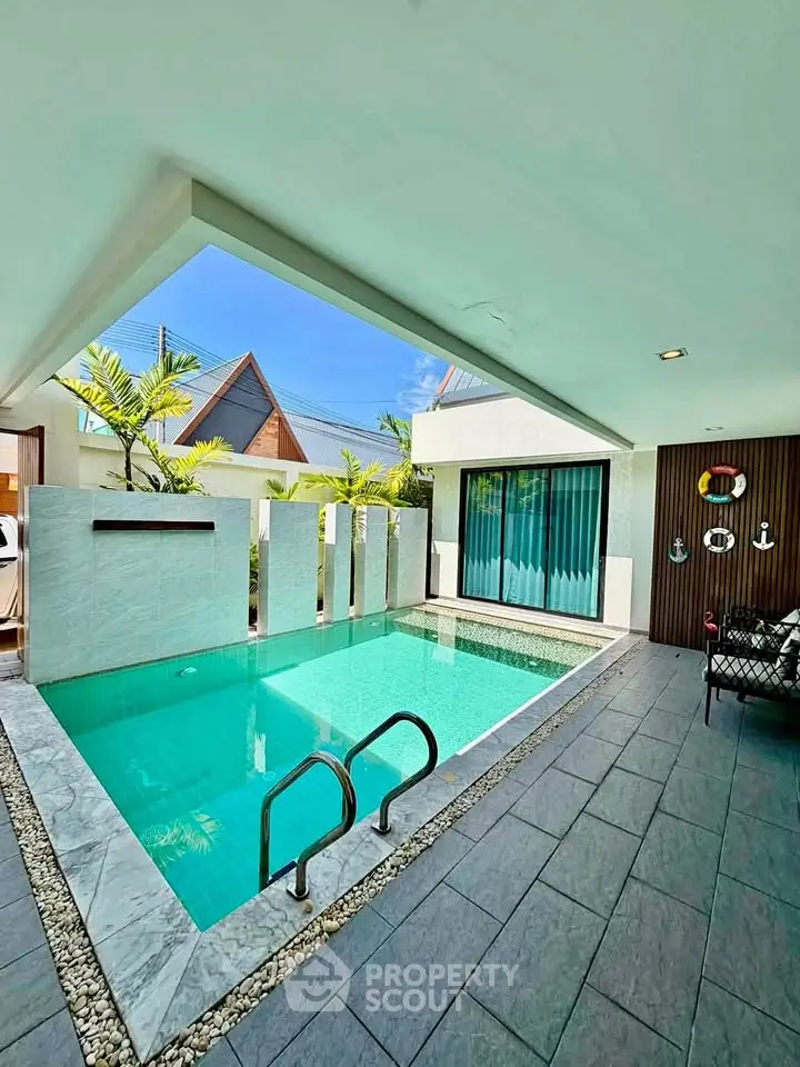 Luxurious private pool area with modern design and tropical ambiance, perfect for relaxation and entertainment.
