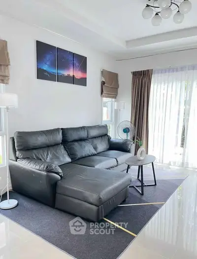 Modern living room with sleek leather sofa and stylish decor