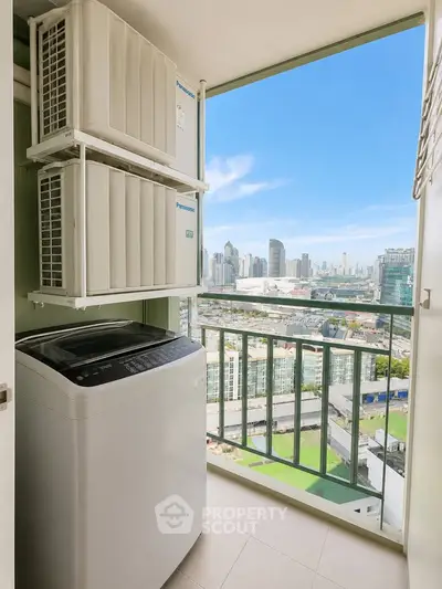 High-rise apartment balcony with washing machine and stunning city view.