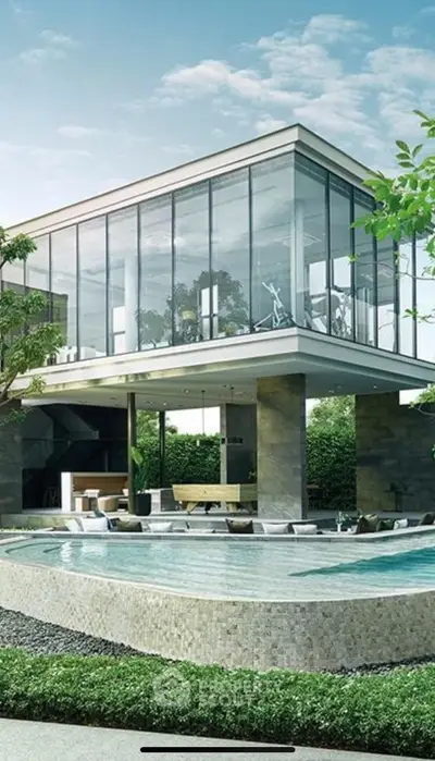Luxurious modern home with glass facade and stunning pool area