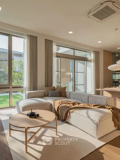 Spacious living room with modern decor and large windows overlooking garden