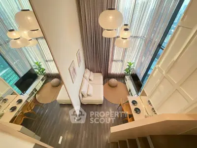 Luxurious high-ceiling living room with modern decor and panoramic city views.