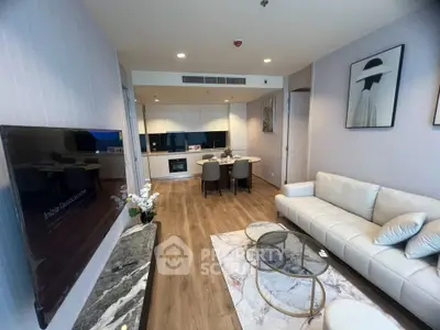 Modern living room with stylish decor and open kitchen layout