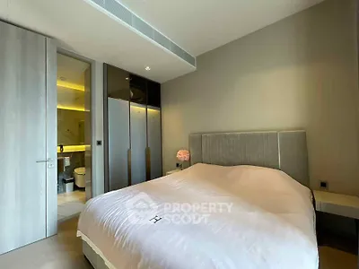 Modern bedroom with ensuite bathroom and sleek design in luxury apartment