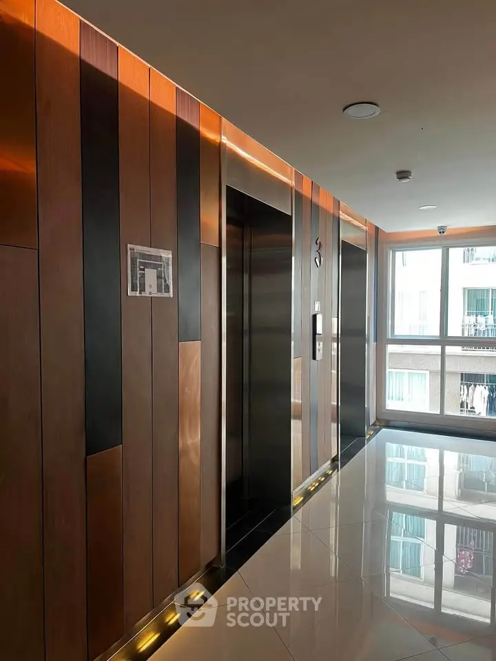 Modern building elevator lobby with sleek design and ambient lighting