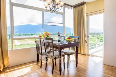 Elegant dining area with mountain view and natural light