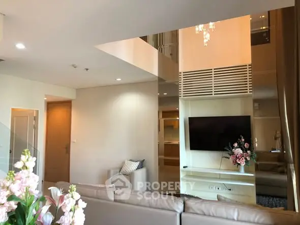 Luxurious modern living room with high ceilings and elegant decor