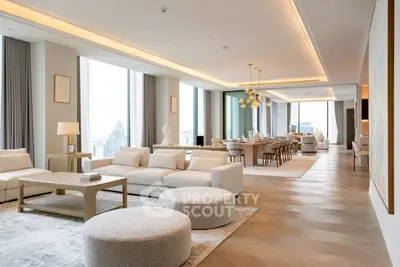 Luxurious open-plan living and dining area with modern decor and stunning city views.