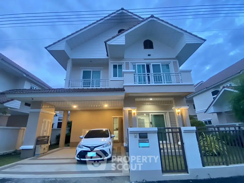 Stunning two-story house with modern design and spacious driveway in a serene neighborhood.