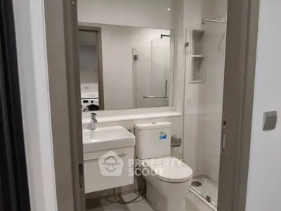 Modern bathroom with sleek fixtures and glass shower enclosure