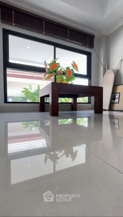 Stylish modern interior with glossy floor and large window view