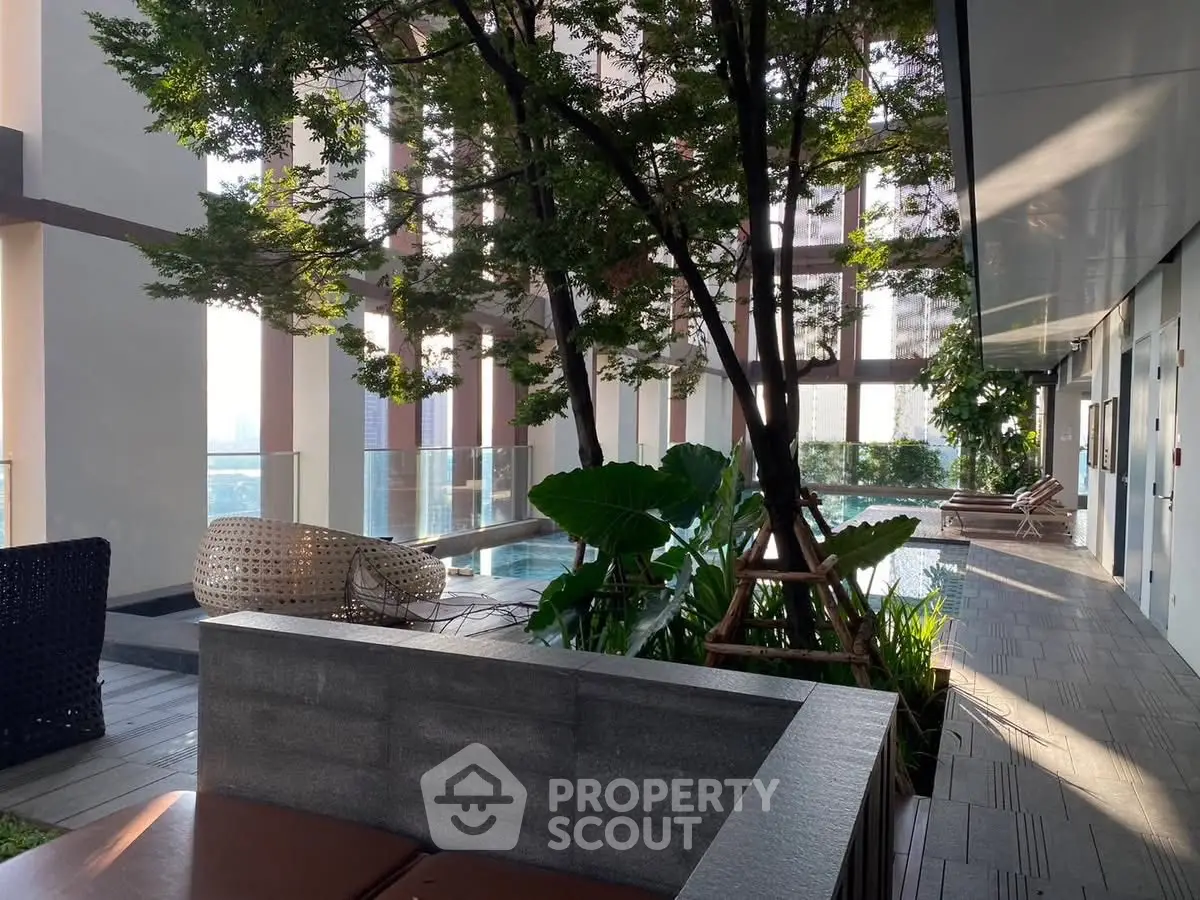 Luxurious rooftop garden with modern seating and lush greenery offering a serene city escape.
