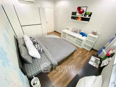 Modern bedroom with stylish decor and ample storage space