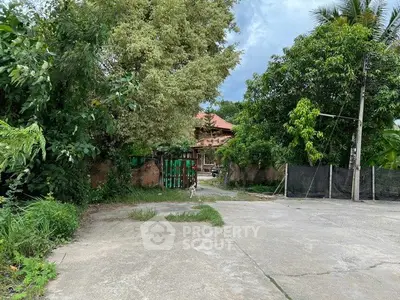 Charming rustic property surrounded by lush greenery and mature trees, offering a serene and private retreat.
