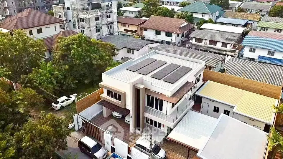 Modern two-story house with solar panels in a suburban neighborhood