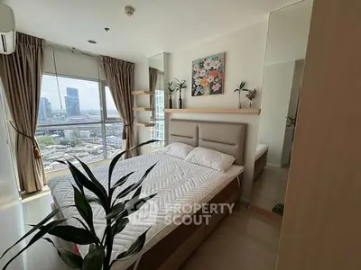 Modern bedroom with city view, large window, and stylish decor in high-rise apartment.