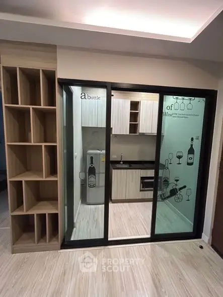 Modern kitchen with sliding glass doors and built-in wooden shelving, perfect for stylish urban living.