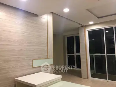 Modern interior with sliding glass doors and recessed lighting