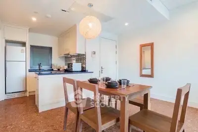 Charming dining area with modern kitchen in open layout apartment