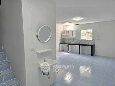 Spacious open-plan area with modern fixtures and ample natural light, perfect for versatile living arrangements.