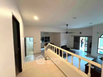 Spacious open-plan living area with modern design and ample natural light, perfect for family gatherings.