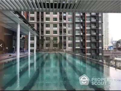 Luxurious apartment complex with stunning rooftop pool and modern architecture