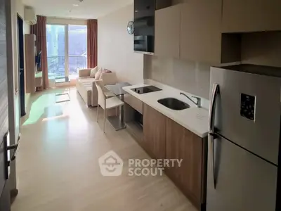 Modern open-layout kitchen and living room with city view