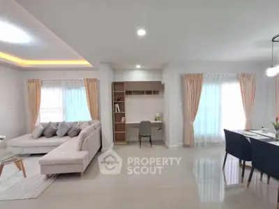 Spacious modern living room with elegant decor and natural light