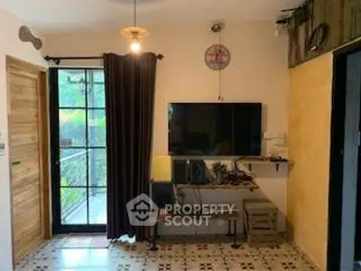 Cozy living room with modern decor and balcony access