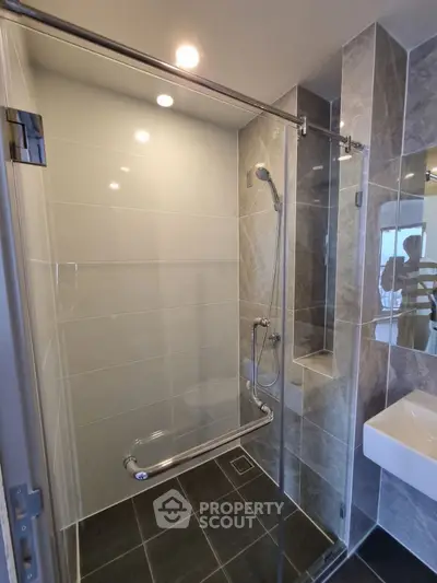 Modern bathroom with glass shower enclosure and sleek design