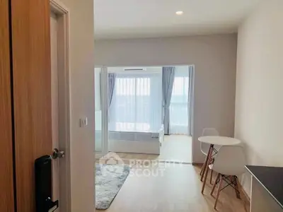 Modern apartment interior with cozy bedroom and dining area, featuring natural light and minimalist design.