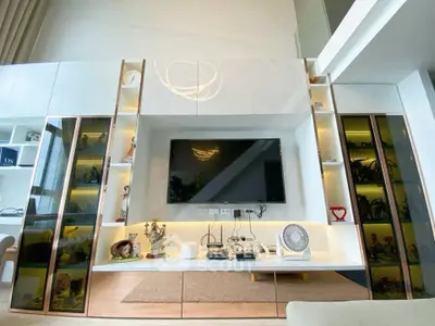 Modern living room with sleek built-in entertainment center and stylish decor