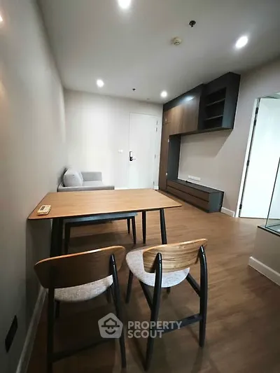 Modern minimalist living room with wooden flooring and sleek furniture