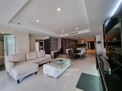 Spacious modern living room with elegant furniture and open layout, perfect for entertaining.