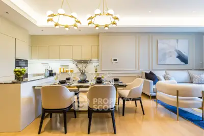 Luxurious open-plan living room and kitchen with elegant dining area and modern decor.