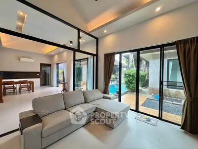Spacious modern living room with pool view and open layout